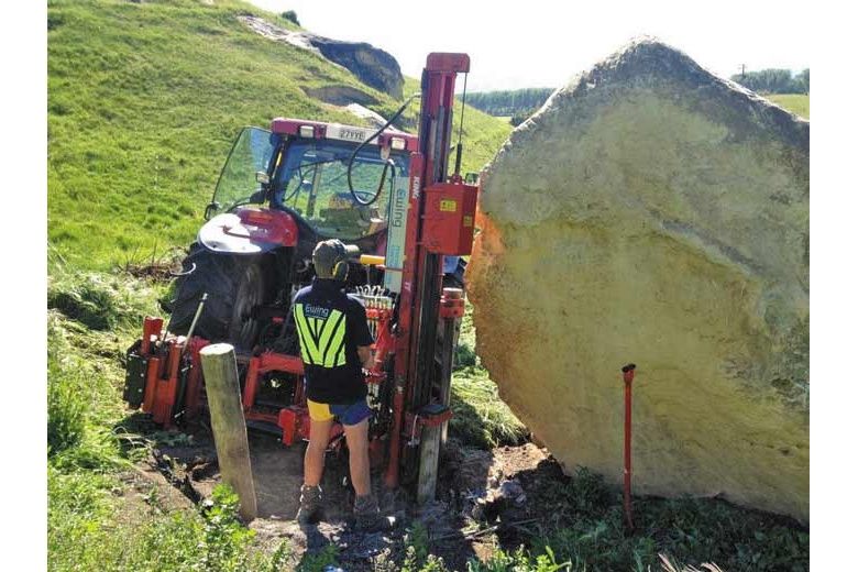 Big rock on fence line second hand post thumper