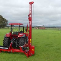 King Country Base on tractor with chainsaw mount between wheels
