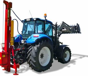 Telescoping Expander postdriver mounted directly behind 4WD tractor with forks