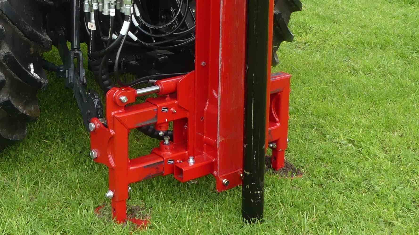 Kinghitter Series 2 post driver mounted to rear of tractor with mast shift and rock spike
