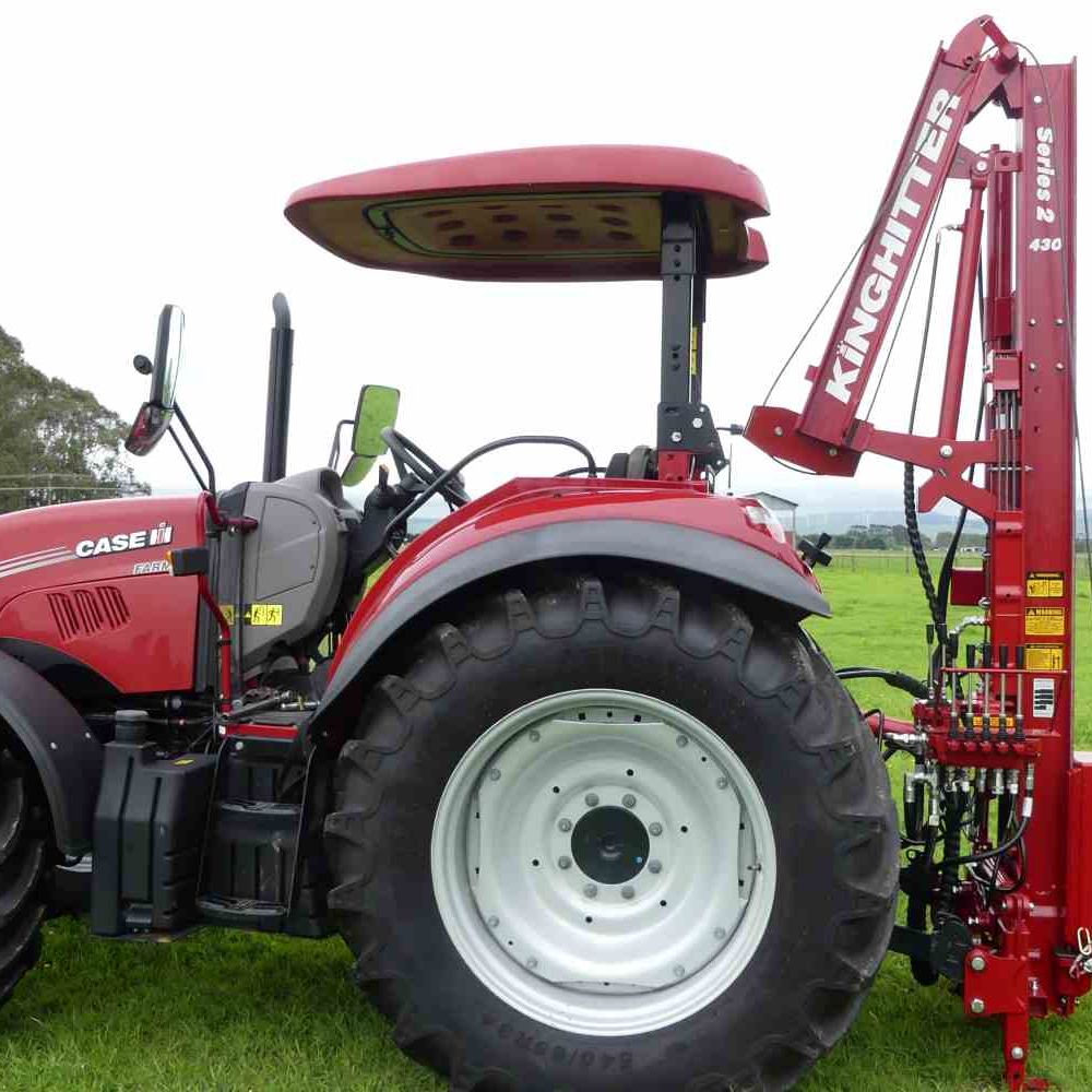 New Series 2 430 Kinghitter postdriver rear mounted to a CASE ROPS tractor. Showing hydraulic hinge mast folded down.